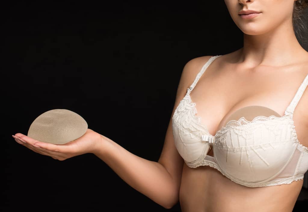 Woman with breast implant