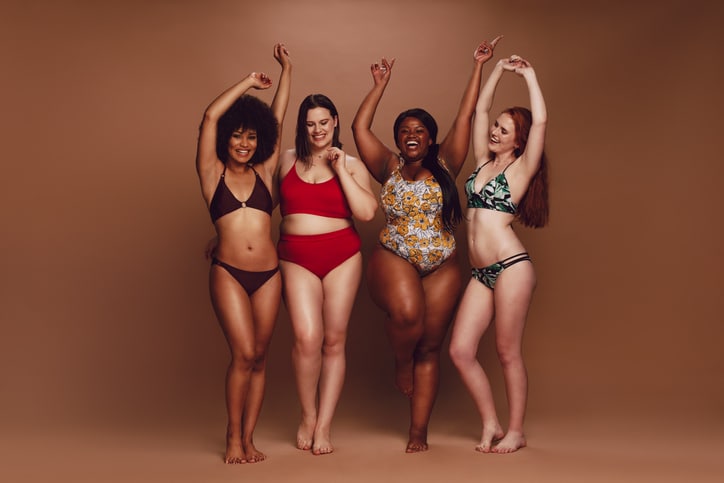A group of young women in underwear dance around cheerfully