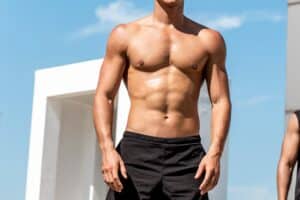 Man's toned, muscular chest after male breast reduction surgery in Dallas, TX