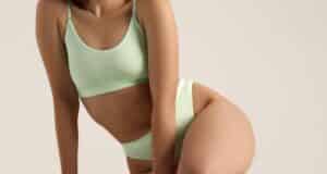 Woman with slim body contours from liposuction in Dallas