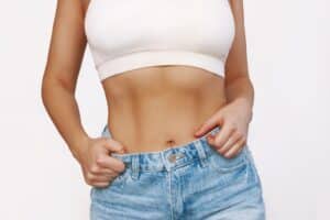 Close up of woman's toned abs after a tummy tuck in Dallas, TX