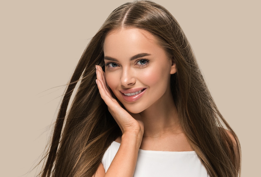 Woman smiling looking young and fresh from non-surgical cosmetic treatments in Dallas, TX